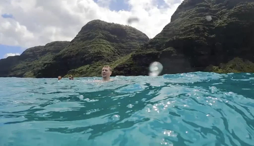 Swimming in the ocean by Napali